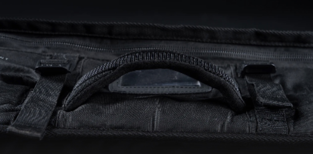 Close-up of the padded carry handle stitched to a black board bag