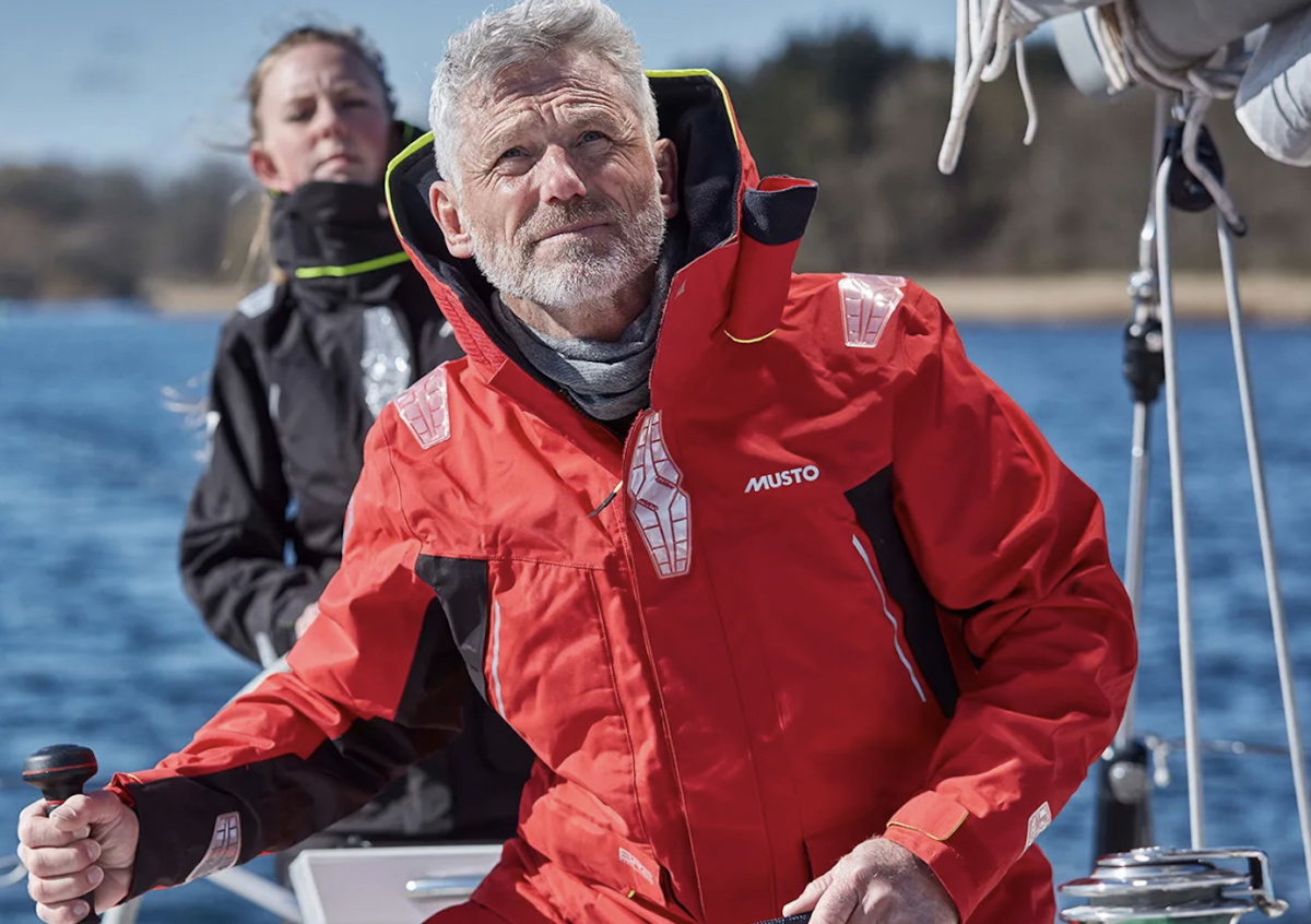 Musto BR sailing jacket and trousers worn on the foredeck of a yacht