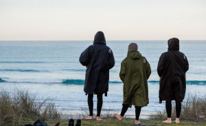 Three people in Nyord Changing Robes on the beach